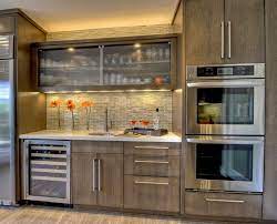 Popularity Of Gray Continues To Grow Dura Supreme Cabinetry Contemporary Kitchen Stained Kitchen Cabinets Glass Kitchen Cabinets