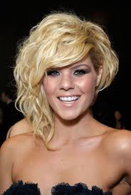 It's a cross between the traditional boyish cut and a bob, and works really well to frame the face with longer strands in front and tucked behind the ears for a feminine touch. Kimberly Caldwell Photostream Asymmetrical Hairstyles Short Asymmetrical Haircut Curly Hair Styles