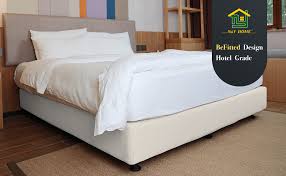 Box spring cover queen is a type of mattress foundation typically comprising a sturdy wooden framework covered in fabric and containing springs. Amazon Com N Y Home Box Spring Cover Sleek Alternative For Bed Skirts Wrap Around Elastic Queen Ivory Home Kitchen