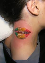 Lips tattoo meaning lips, particularly female, are used often as an image to represent erogenous and intimate activity, especially when pictured in a color or pattern associated with passion. Tattoos By Piotr Dedel Inked Magazine Lip Tattoos Rasta Tattoo Neck Tattoo