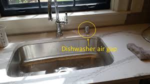 A device installed under the sink between the drain and the trap and used to dish washer water supply: A Common Dishwasher Installation Defect With An Easy Fix Wilson Home Inspections
