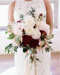 Composed of red, burgundy & pink peony, ranunculus and other complementary flowers. Pin On November Wedding
