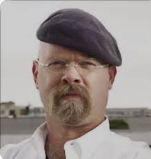 Police and the FBI have captured a man in McHenry wanted for robbing a bank  while implying he was armed with a gun in Kildeer Friday morning,  authorities announced.