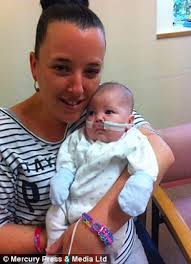 Mother 'advised to abort unborn son' holds him for the first time