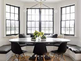 The result is a formal dining room feel that uses up only one wall of the kitchen. Black And White Bay Window With Built In Banquette And Oval Dining Table Contemporary Kitchen