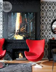 This red, beige and white living room is achieved by using a favorite fabric to make curtains, pillows and an ottoman cover. Black And White Rooms With Red Accents Brighten Up Loft In Toronto