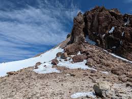 Shasta is just a hike right now via Clear Creek. I dayhiked it a couple  days ago in trail runners and hiking poles, no axe/crampons/etc needed.  Beautiful route on the east side