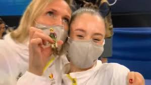 Nina derwael (bel) talks to gymcastic after winning gold in the uneven bars final at the 2019 world. 8o5qzflcajaqqm