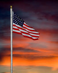 Traditional guidelines call for displaying the flag in public only from sunrise to sunset. American Flag Sunset At Gulf Shores Plantaion Mapio Net
