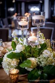 Simple And Elegant Wedding Centerpiece Made Of White Flowers And Ste Wedding Table Centerpieces Elegant Flower Centerpieces Wedding Elegant Wedding Centerpiece