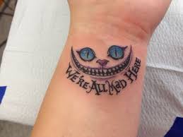 We Are All Mad Here Cheshire Cat Tattoo On Left Wrist Jpg 736 552 Pixels Cheshire Cat Tattoo Foot Tattoos Tattoos