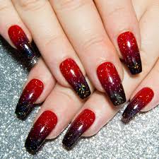 Since acrylic nails are a combination of liquid monomer and powder polymer when applied to your nails and exposed to the air, they form a hard layer, so you're guaranteed to have cute and strong nails. Black Acrylic Nails With Red Glitter Nail And Manicure Trends