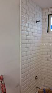 Needed To Get An Edging For The Tile Opted For This White Tile Edge Shower Still Being Grouted And Finished Tile Edging Shower Tile Trim Tile Edging Ideas