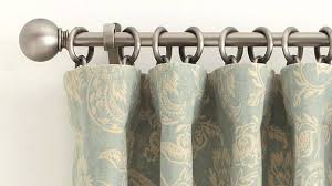 This would require a decorative traverse rod that has the little clips to attach the drapes. How To Correctly Hang A Drape At Home Pottery Barn Youtube