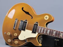 A gorgeous color combo, a black and gold dress is a welcome addition to any woman's closet. 1974 Gibson Les Paul Signature Gold Top Guitarpoint