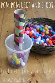 Pom Pom Drop And Shoot Toddler Play The Imagination Tree Motor Skills Activities Toddler Activities Toddler Play