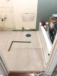While your bathroom's ceramic tile floors will endure much more wear and tear than an ancient urn or pitcher, ceramic's durability makes it ideal for use underfoot. Laying Floor Tiles In A Small Bathroom Houseful Of Handmade