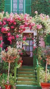 The House And Garden Of Claude Monet Giverny France I Love The Idea Of Framing The Front Entry With Vines Beautiful Gardens Giverny France Beautiful Doors