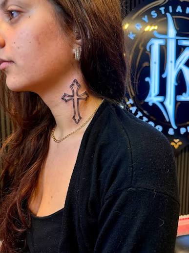 Fresh neck tattoo – a bold cross design, clean lines and sharp placement. Powerful symbol and strong statement piece. Done at Krystian Tattoo & Piercing, Helsingborg. #NeckTattoo #CrossTattoo #FreshInk #BlackInk #TattooArt #BodyMods #