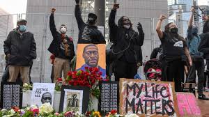 George floyd's son, quincy mason floyd (c r) and family attorney ben crump (c l) and other family members visit on june 3, 2020, the site where george floyd died in picture taken with a drone. Us Protesters Call For Justice Ahead Of George Floyd Murder Trial