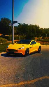 Image result for Sunburst Yellow 2012 Aston Martin