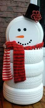 He wears a red vest, a red and white striped scarf, a black top hat, and 3 black buttons. Christmas Diy Diy Snowman Made Of Diy Snowman Made Of Tires Very Christmas Decorations Diy Outdoor Snowman Christmas Decorations Outdoor Christmas Decorations