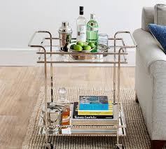 The tray becomes a box with more texture and height interest, some votives and fresh flowers, it's such a quaint and lightly stylish way to decorate. Harrison Round Serving Tray Pottery Barn