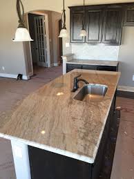 Talk with at least three kitchen remodeling companies about installing your kitchen island. New Construction Kitchen Island Installation 3cm Astoria Granite Brown Bathroom Decor Granite Kitchen Granite Kitchen Island
