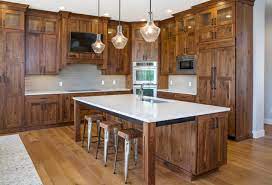 This rustic kitchen features golden brown shaker cabinetry paired with a mint green wall hue and cherry, oak, maple and hickory are also popular choices for kitchen cabinets. Rustic Walnut Cabinetry Rustic Kitchen Salt Lake City By Crown Cabinets Houzz
