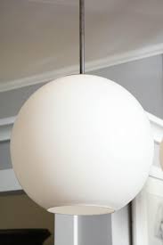 Well you're in luck, because here they come. Large Vintage Milk Glass Globe Pendant With Antique Brass Canopy For Sale At 1stdibs
