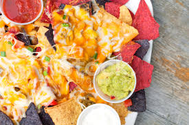 Place the avocados in a bowl and mash lightly with a fork. Nachos Salsa Guacamole And Sour Cream On A Plate Stock Photos Freeimages Com