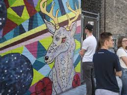 Supported by the east side business improvement become a sponsor! Plenty Of Horne Black Cat Mural Alley Opens Urban Milwaukee