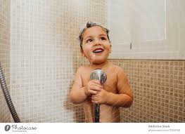 Most baby showers are thrown approximately 4 to 6 weeks before the baby is born. Cute Boy Singing In Shower At Home A Royalty Free Stock Photo From Photocase