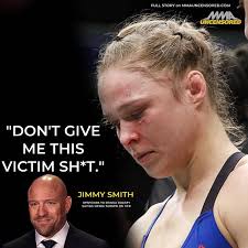 Ronda Rousey and Jon Moxley wrestling