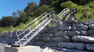 This document provides building photographs, and examples of defects found in inspecting indoor or outdoor stairs, railings, landings, treads, and related conditions for safety and proper construction. Aluminum Stairs Alumidock