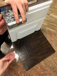 We loved helping this return client update their cozy condo kitchen into a functional space using our popular white shaker cabinets and new caledonia granite! 9 New Caledonia Granite Ideas Caledonia Granite Granite Kitchen Cost Of Granite Countertops