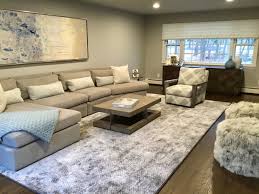 The living room design layout is open and inviting, with the sectional and armchair creating a conversational setting. Cozy Modern Family Room Minimalistisch Wohnzimmer New York Von Just The Right Piece Houzz