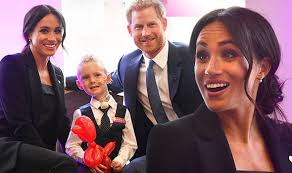 Meghan Markle and Prince Harry share tender moment as they meet seriously  ill children