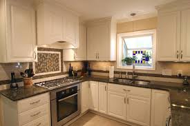 Pin By Lauren Reeves On Kitchen Antique White Kitchen Cabinets Brown Granite Countertops Black Granite Countertops