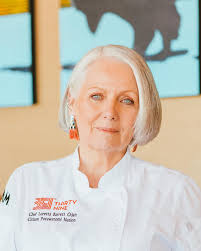 Alaska native woman smokes moose in smokehouse