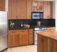 Black countertops are also best combined with brightly colored cabinets. Kitchen Backsplashes For Black Granite Countertops Top Backsplashes For Kitchens Ki Trendy Kitchen Backsplash Cherry Cabinets Kitchen Black Granite Countertops