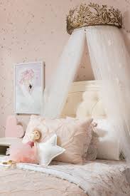 The bed was changed to be like a princess's room with white pillars. Aria S Princess Room Project Nursery Girls Princess Room Girl Bedroom Decor Girls Princess Bedroom