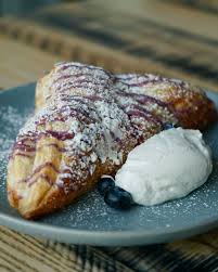 A delightful treat to brighten your day 🫐 Blueberry Turnover • vanilla  whipped cream #blueberryturnover #canvaslakenona #canvas #lakenona  #orlandofoodies #canvascocktails #orlandofl