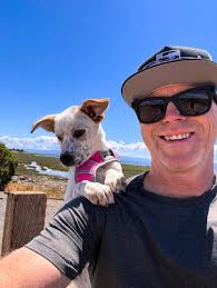 Having a fun game of fetch. Dirt in mouth is mandatory.