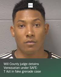 A Venezuelan national will remain in the Will County jail in a case where  he's charged with selling fake grenades during an undercover operation.