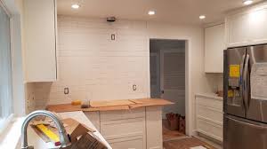 should i extend backsplash over doorway?
