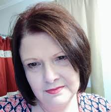 Julie's Designs & Signs added a...