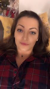 Playful French Bulldog Enjoys Couch Time with Owner