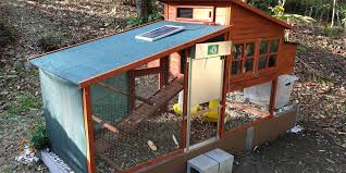 Tiny red and white doghouse style chicken coop that would fit in any backyard. 11 Backyard Chicken Coop Ideas For Aspiring Homesteaders