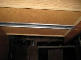 The system that is most commonly used on toolbox drawers uses a strip of metal that the drawer slides along. How Do I Remove This Sliding Drawer In My Kitchen Home Improvement Stack Exchange
